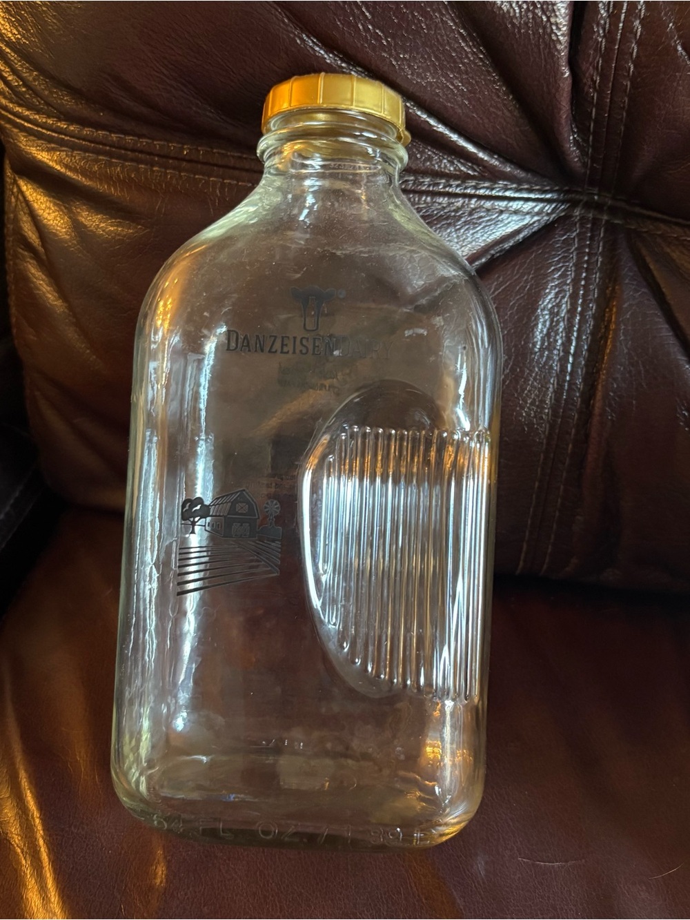 VINTAGE Glass Milk Bottle 64 oz Danzeisen Dairy  Made in USA Blue Writing
Size: